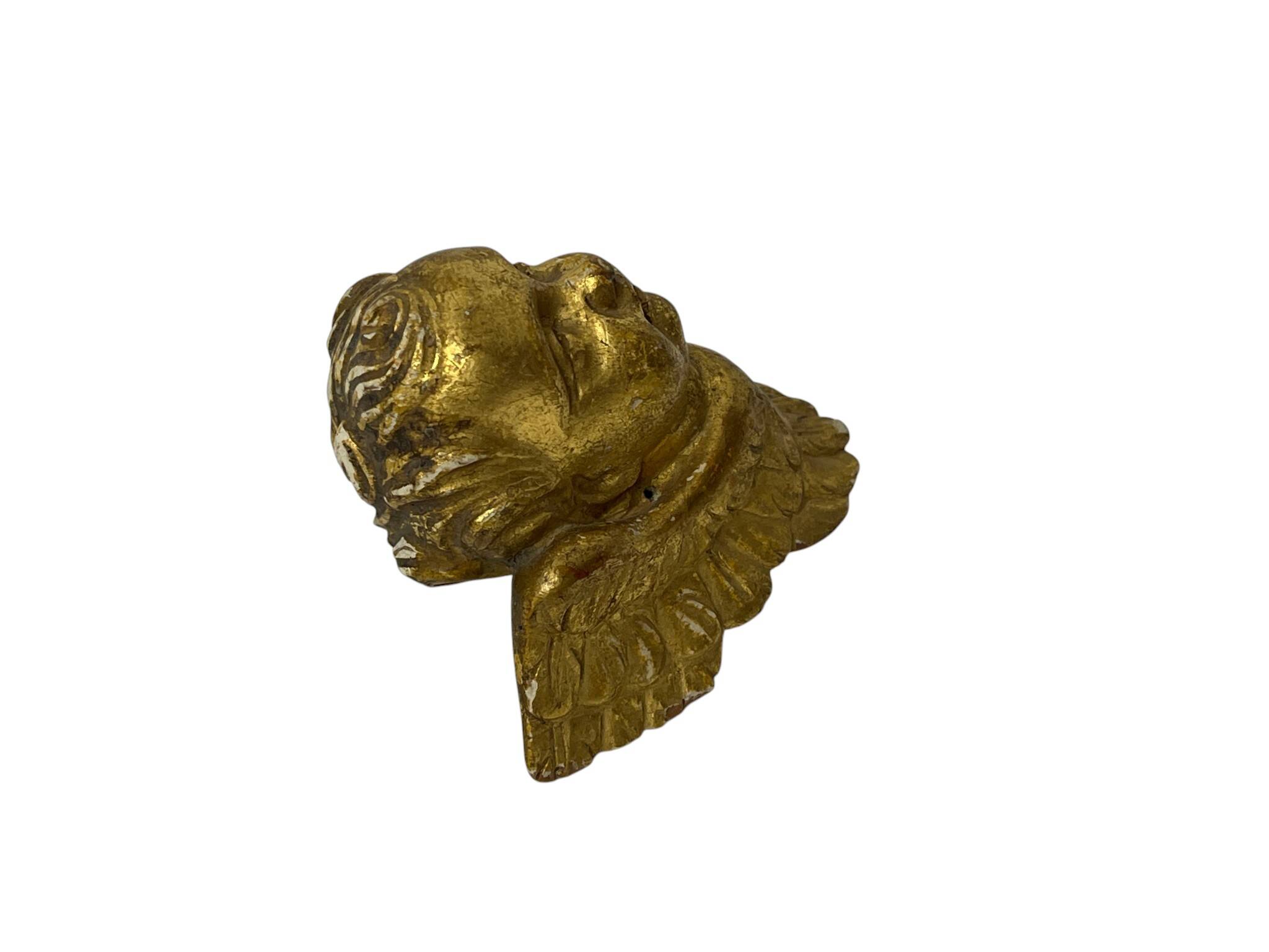 Antique cherub head in gilded wood from the early 20th century.