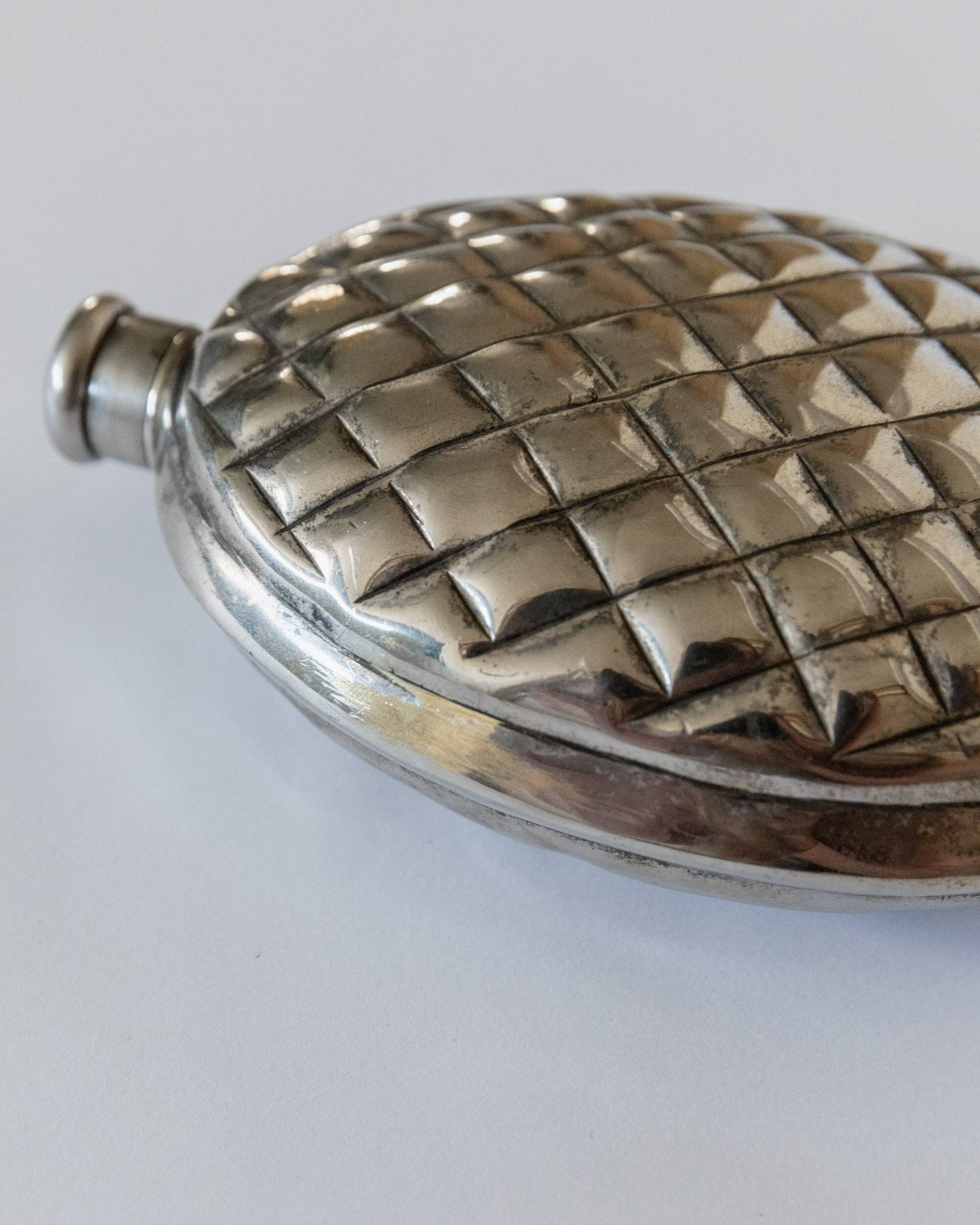 Vintage 1950s silver-plated flask in the shape of a pine cone.