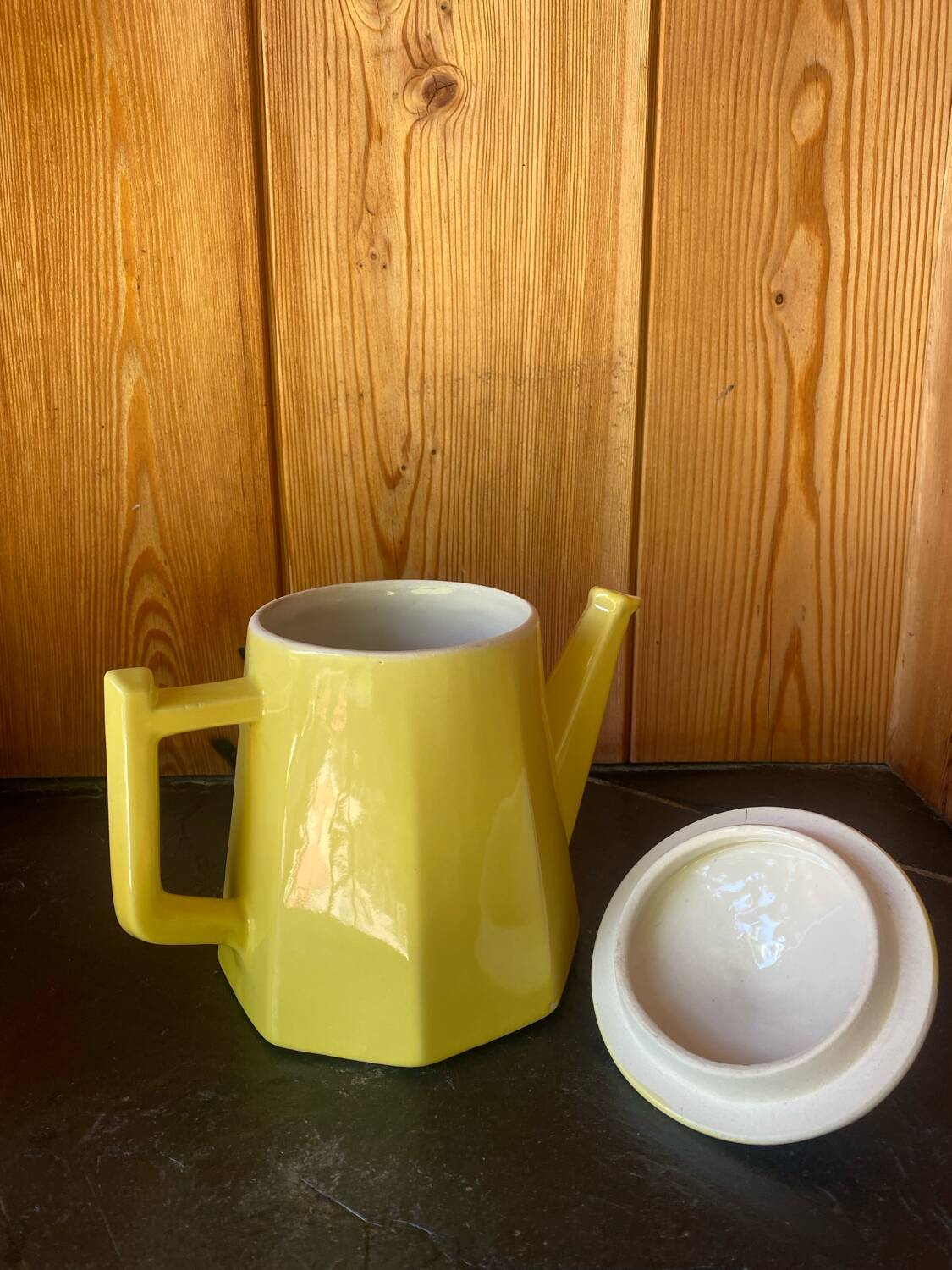 Vintage yellow ceramic teapot and milk jug.