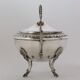 Silver sugar bowl with paw feet and ornate handles