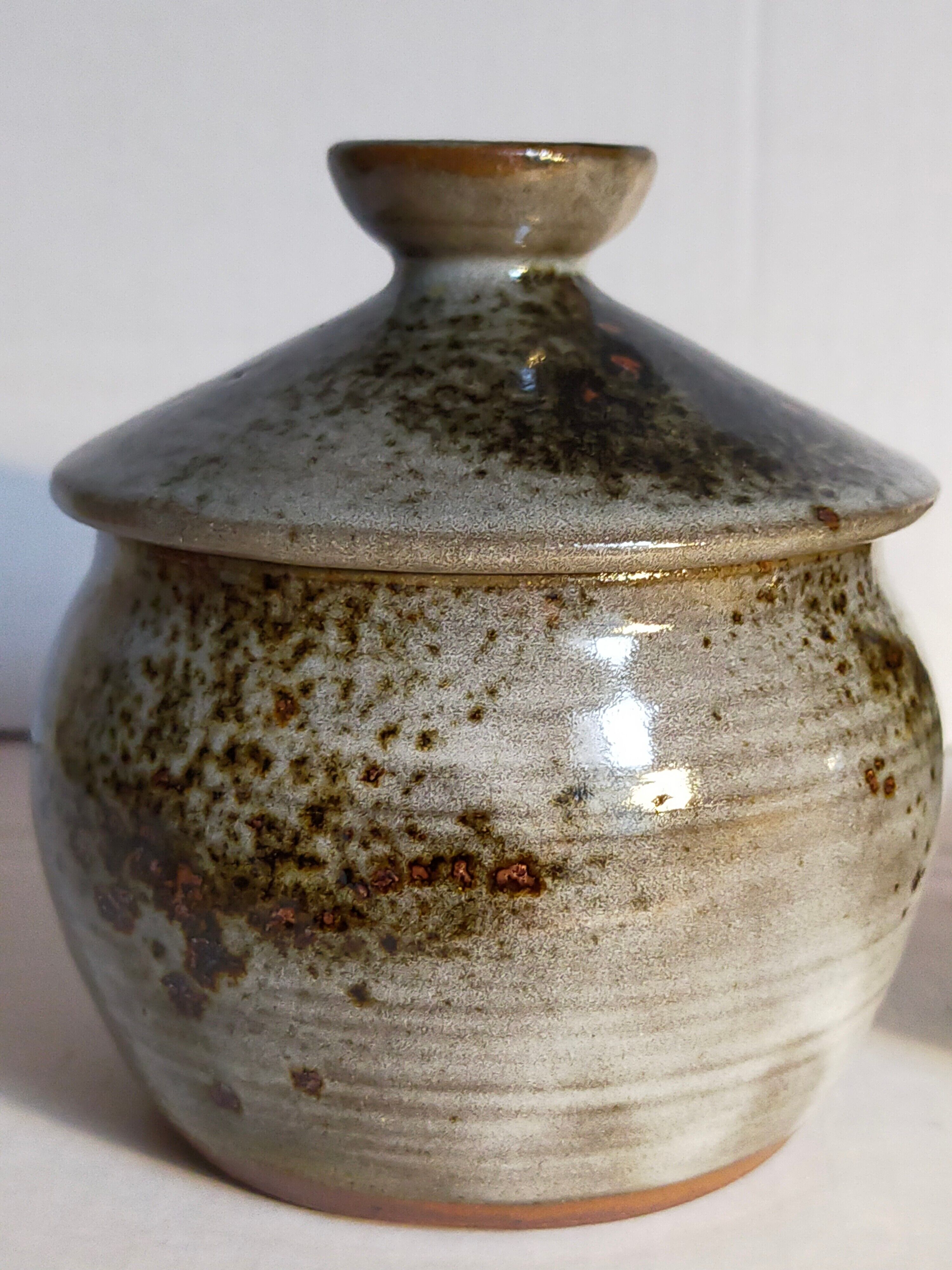 Duo of potter's pots covered in vintage glazed stoneware