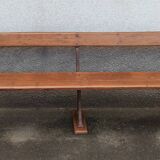 Old wooden bench with cast iron base
