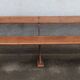 Old wooden bench with cast iron base