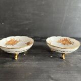 Pair of tripod bowls in gilded Limoges porcelain.