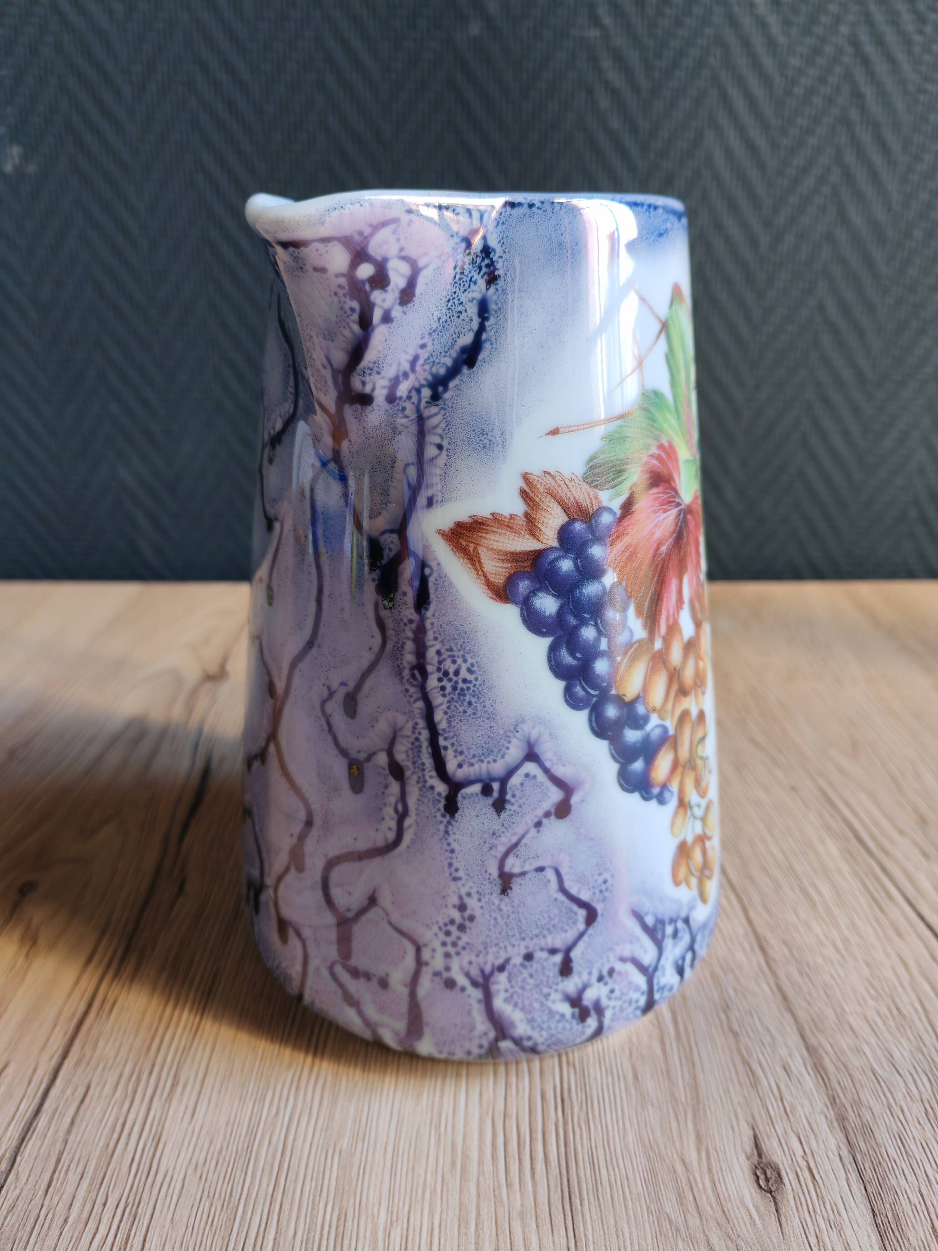 Vintage porcelain pitcher Lusseray France, decorated with grape clusters.