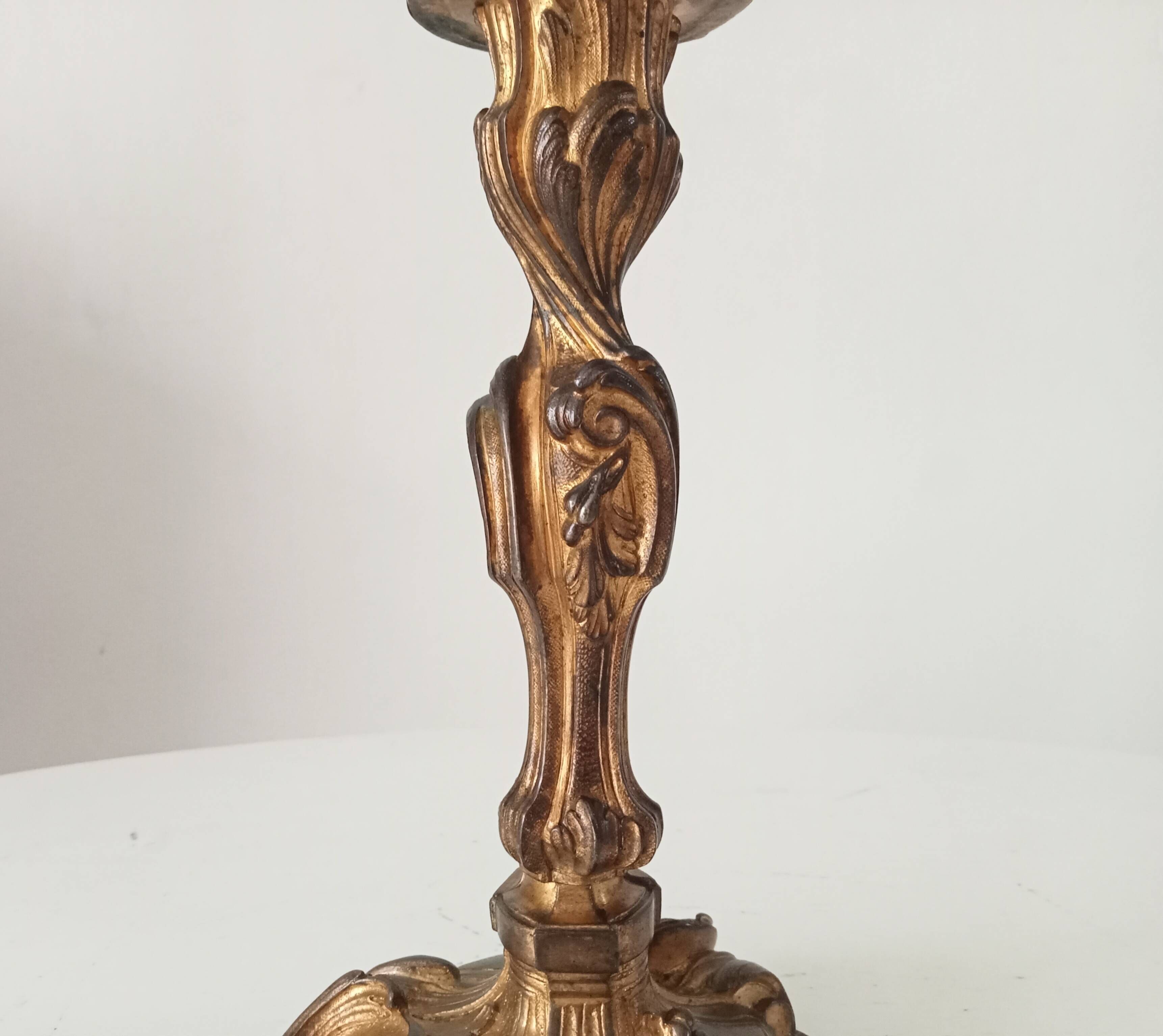 Antique 19th-century solid gilded bronze candlestick in the Louis XV style.