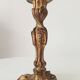 Antique 19th-century solid gilded bronze candlestick in the Louis XV style.