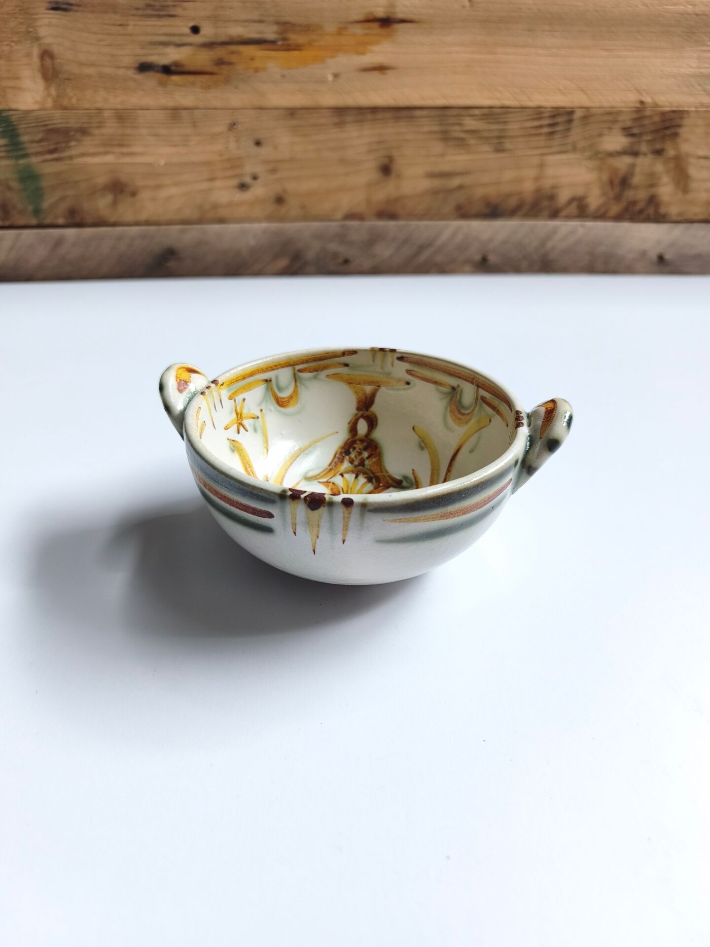 Vintage bowl signed Keraluc Quimper in yellow and green.