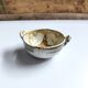 Vintage bowl signed Keraluc Quimper in yellow and green.