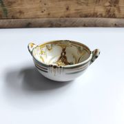Vintage bowl signed Keraluc Quimper in yellow and green.