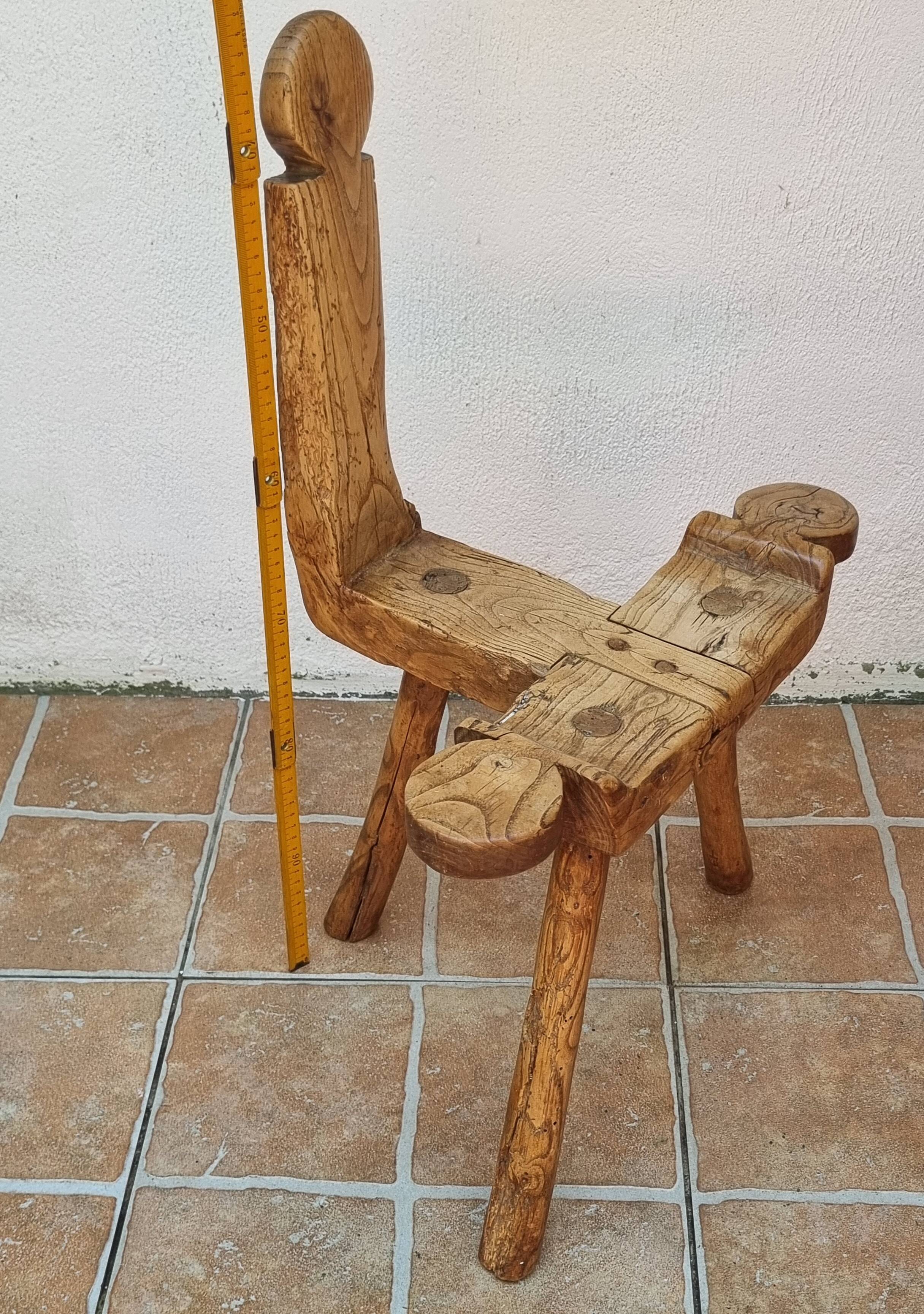 Brutalist chair in solid wood, European handcrafted work from the early 20th century.