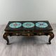 Black lacquered wooden coffee table with cloisonné and polychrome decoration, 20th century.