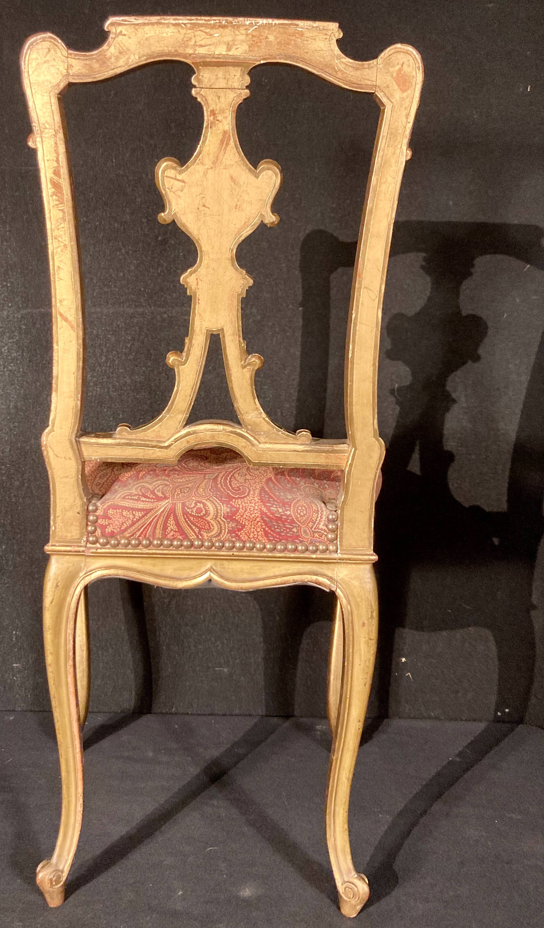 Pair of gilded wooden chairs
