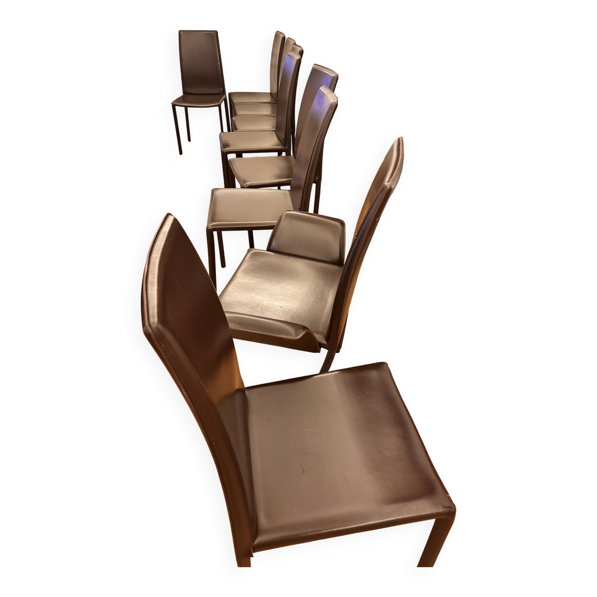 Many brown leather chairs "Roche Bobois"