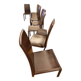 Many brown leather chairs "Roche Bobois"