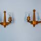 Pair of two-armed art deco "ball" wall lights, carved wood, France, 1960