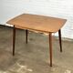 Extendable vintage dining table in teak wood