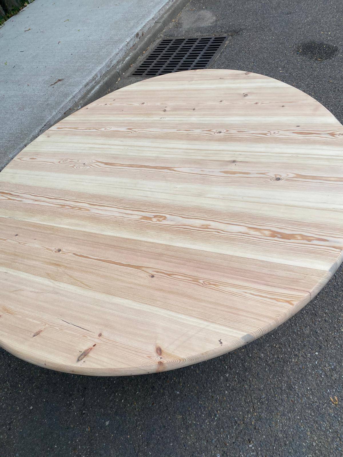 Scandinavian round dining table with a central base, stripped, made of solid raw wood, 90.