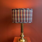 Lamp base in gilded brass, oval silk lampshade with a checkered pattern in burgundy.