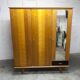 French wardrobe with tapered legs, 3 doors, 1 mirror (27*130), and 1 drawer.