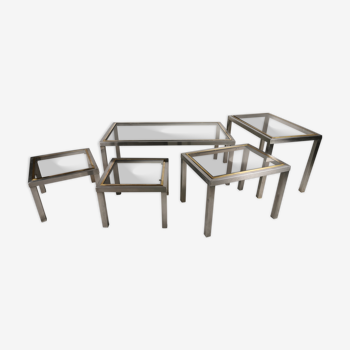 Suite of 5 coffee tables in chrome metal, brass, smoked glass. around 1970