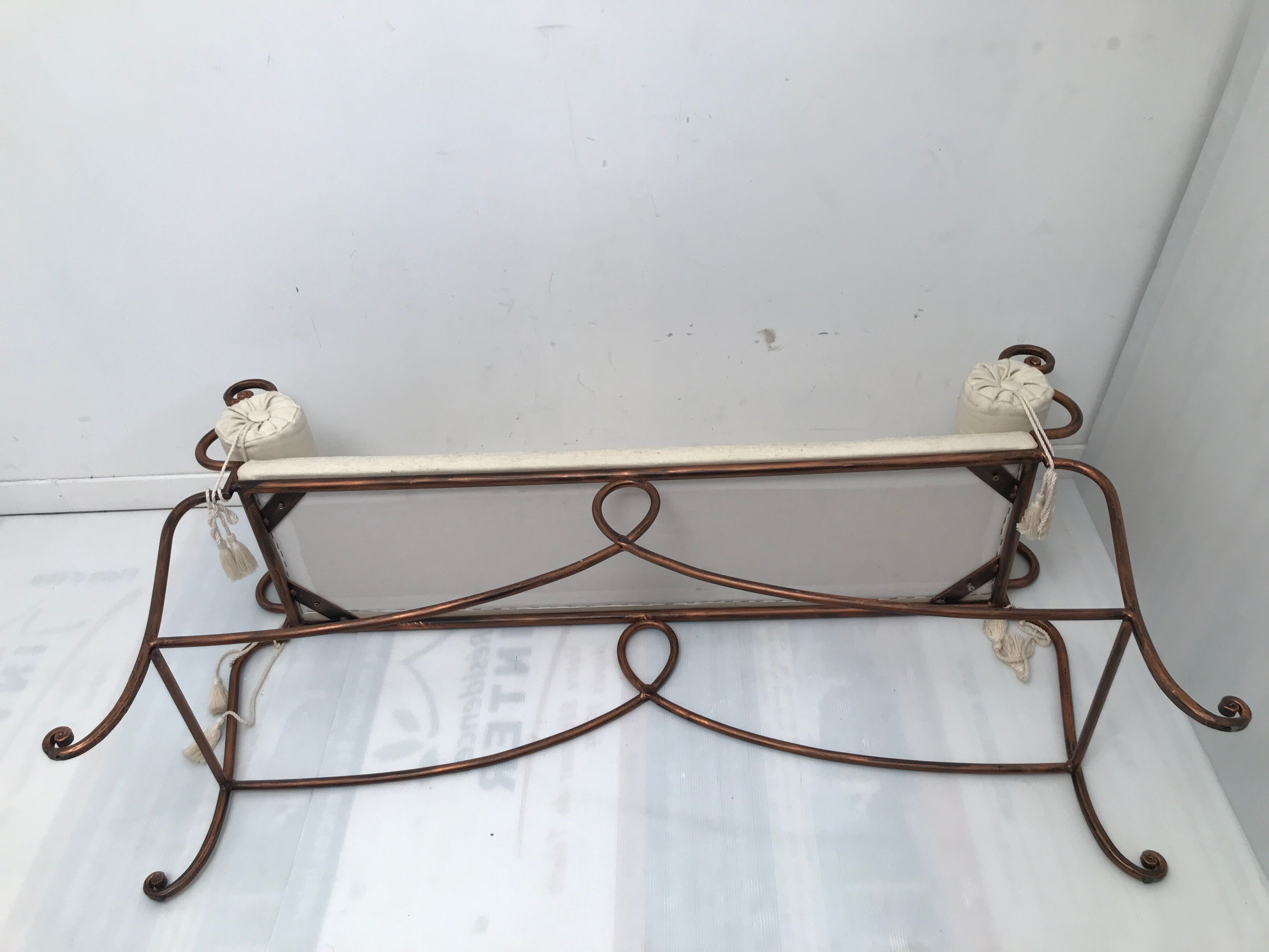 Copper wrought iron bench with cushions