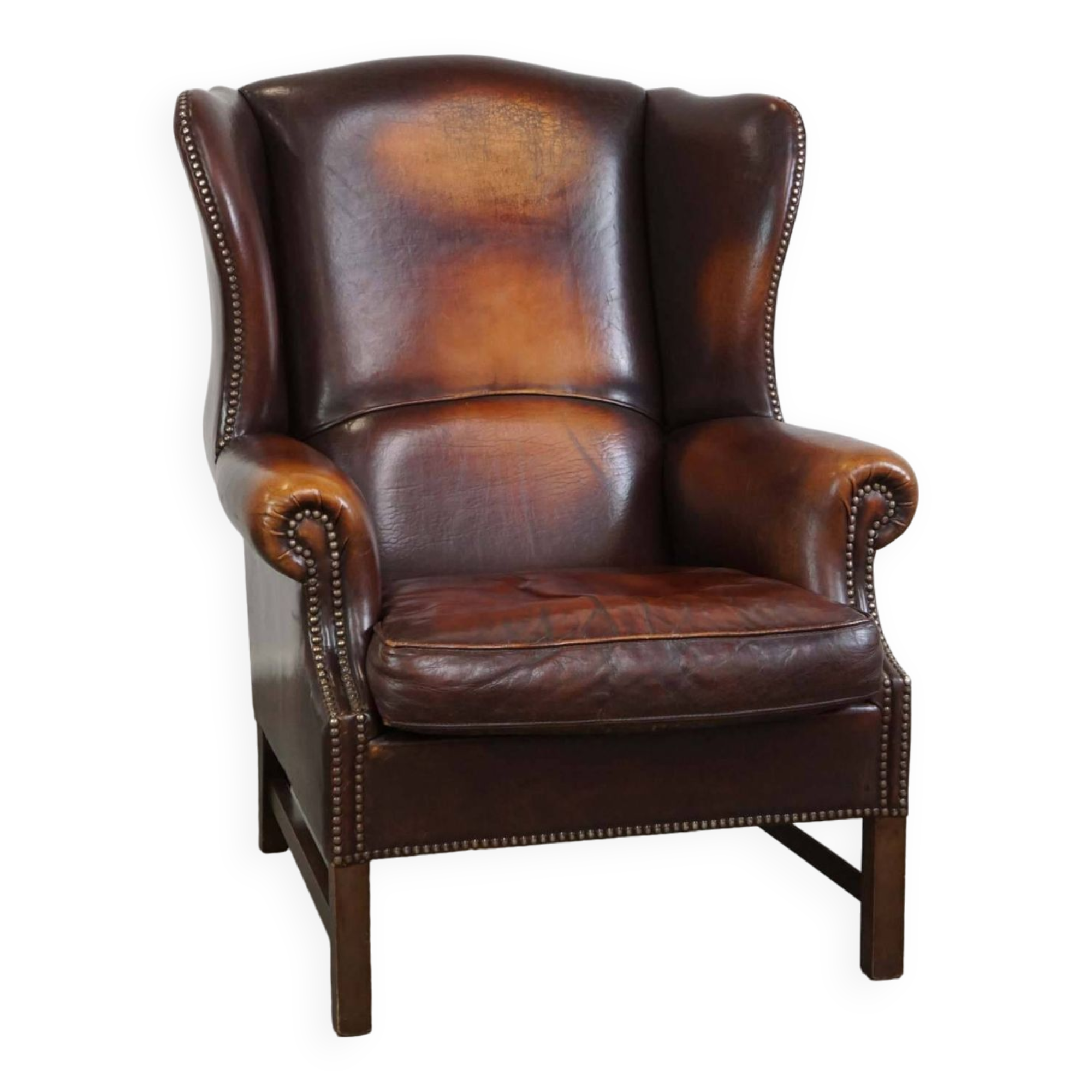 Beautiful classic and stately wingback armchair made of sheep leather with beautiful colors