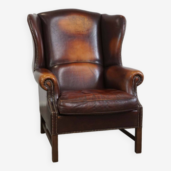 Beautiful classic and stately wingback armchair made of sheep leather with beautiful colors