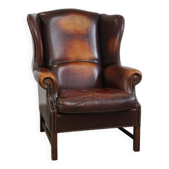 Beautiful classic and stately wingback armchair made of sheep leather with beautiful colors