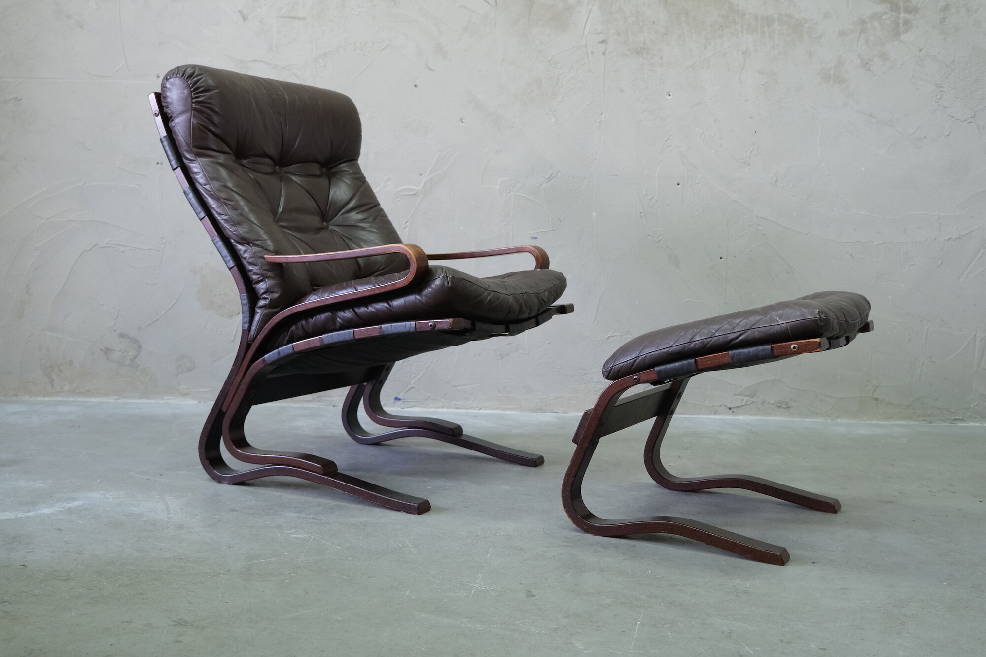 Mid century leather armchair and foot stool by Erda & Nordahl Solheim, Norway 1970's