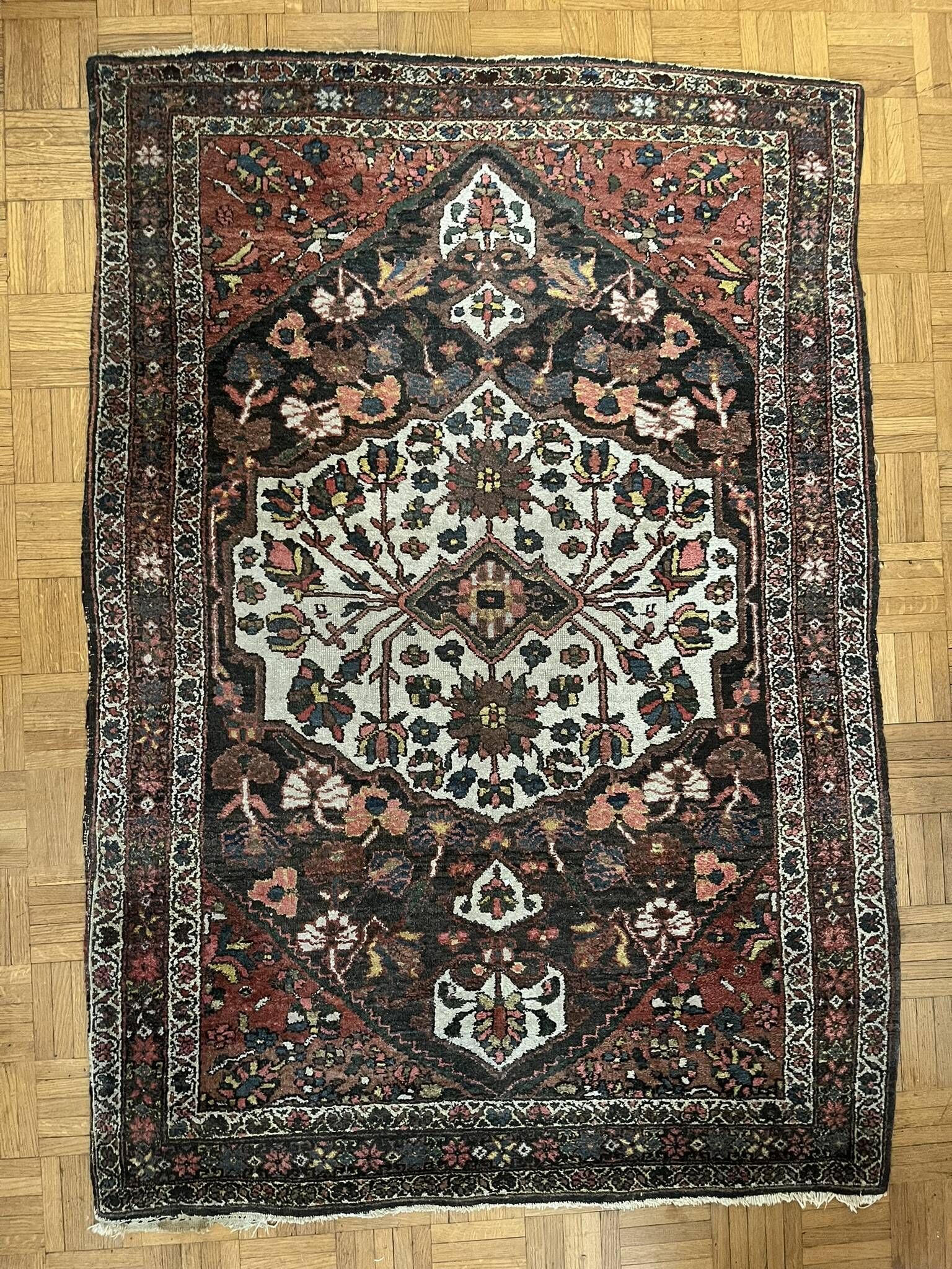 Antique handmade Hamadan Persian rug, ivory medallion on dark background 148x103.