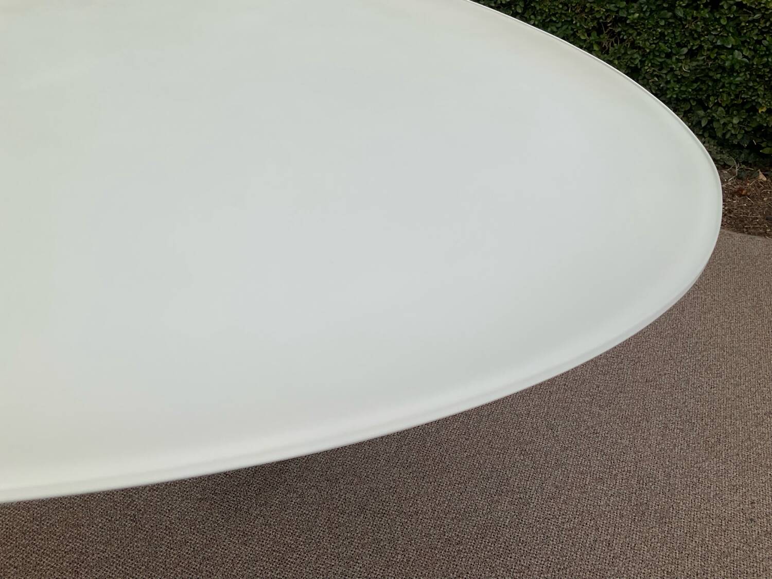 Oval designer dining table in frosted glass and brushed stainless steel