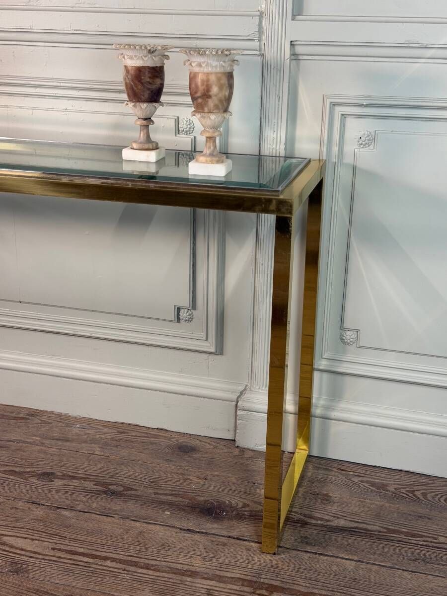 Golden and chrome metal console, bevelled glass, circa 1980.