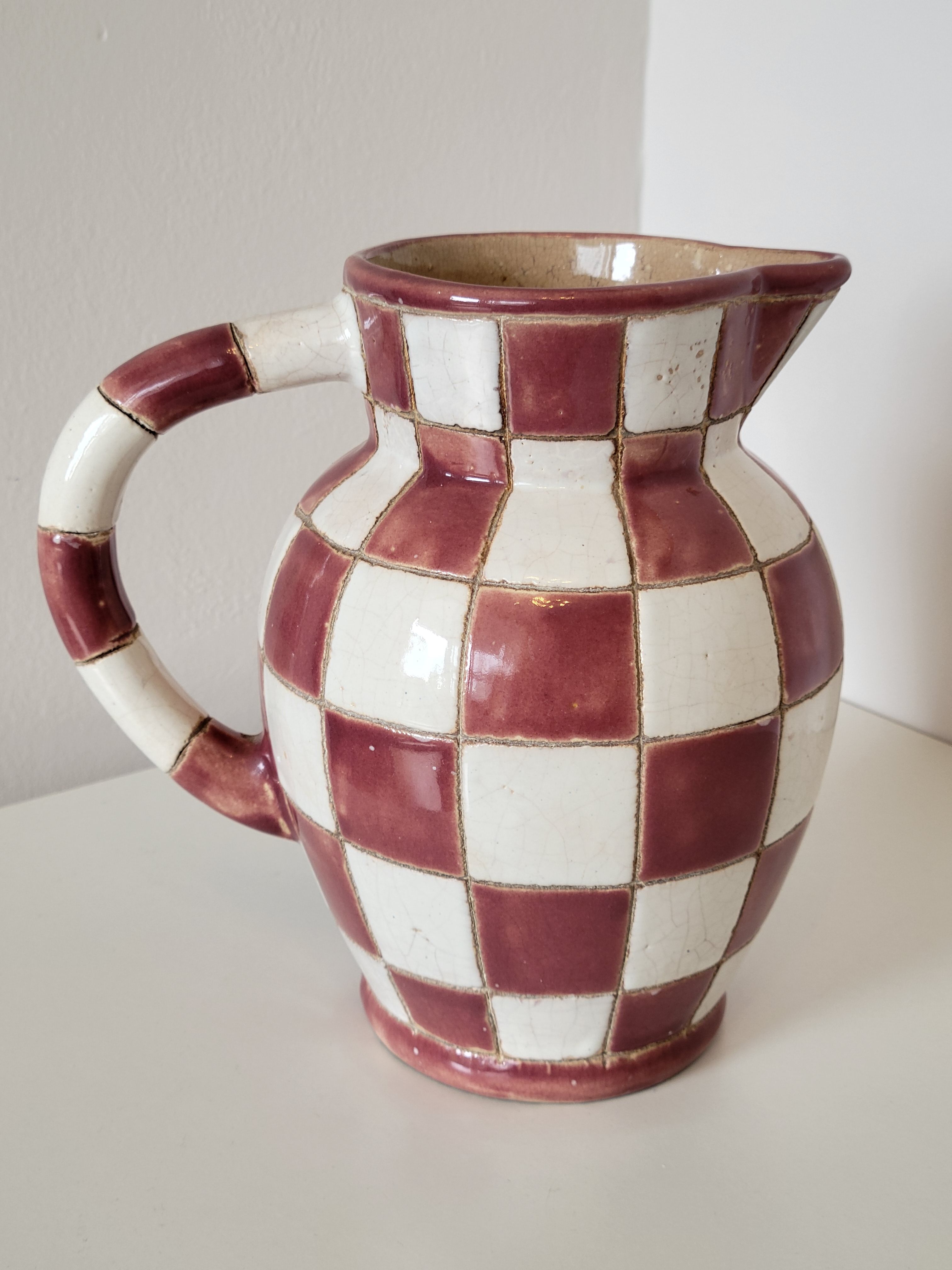 Old ceramic pitcher pattern checkerboard tiles