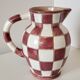 Old ceramic pitcher pattern checkerboard tiles