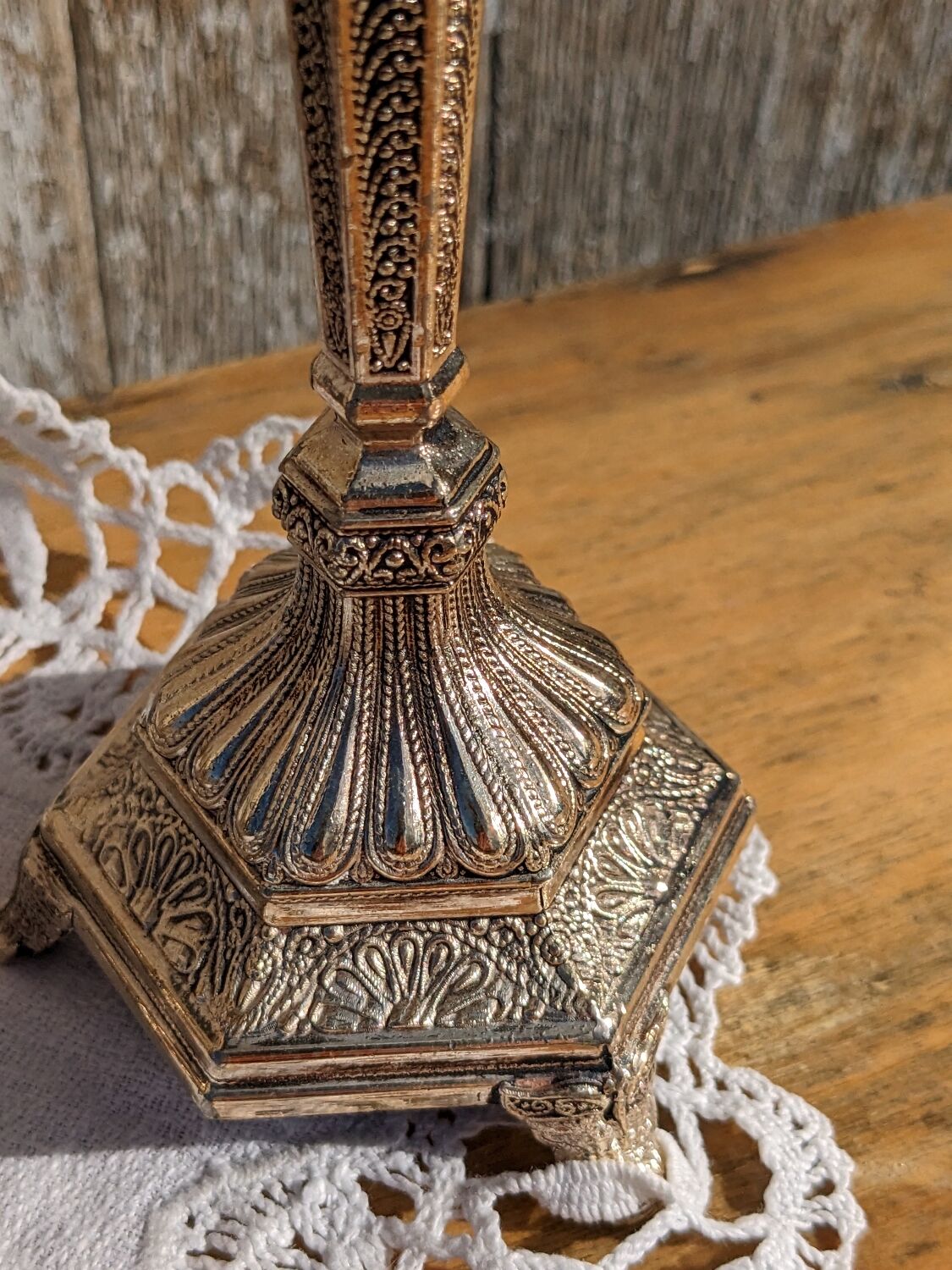 Pair of chiseled metal candle holders