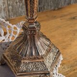 Pair of chiseled metal candle holders