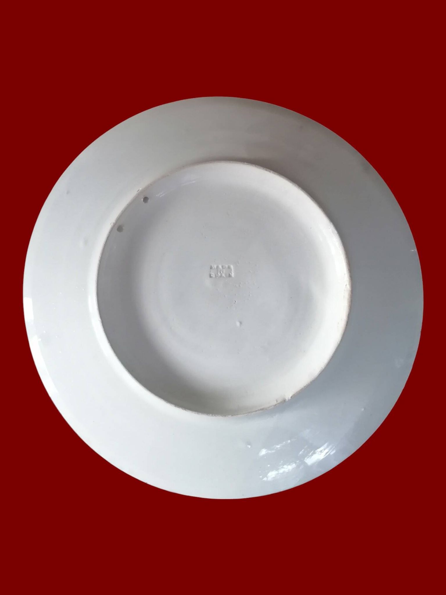 Grand plat rond en faience d'ibiza.