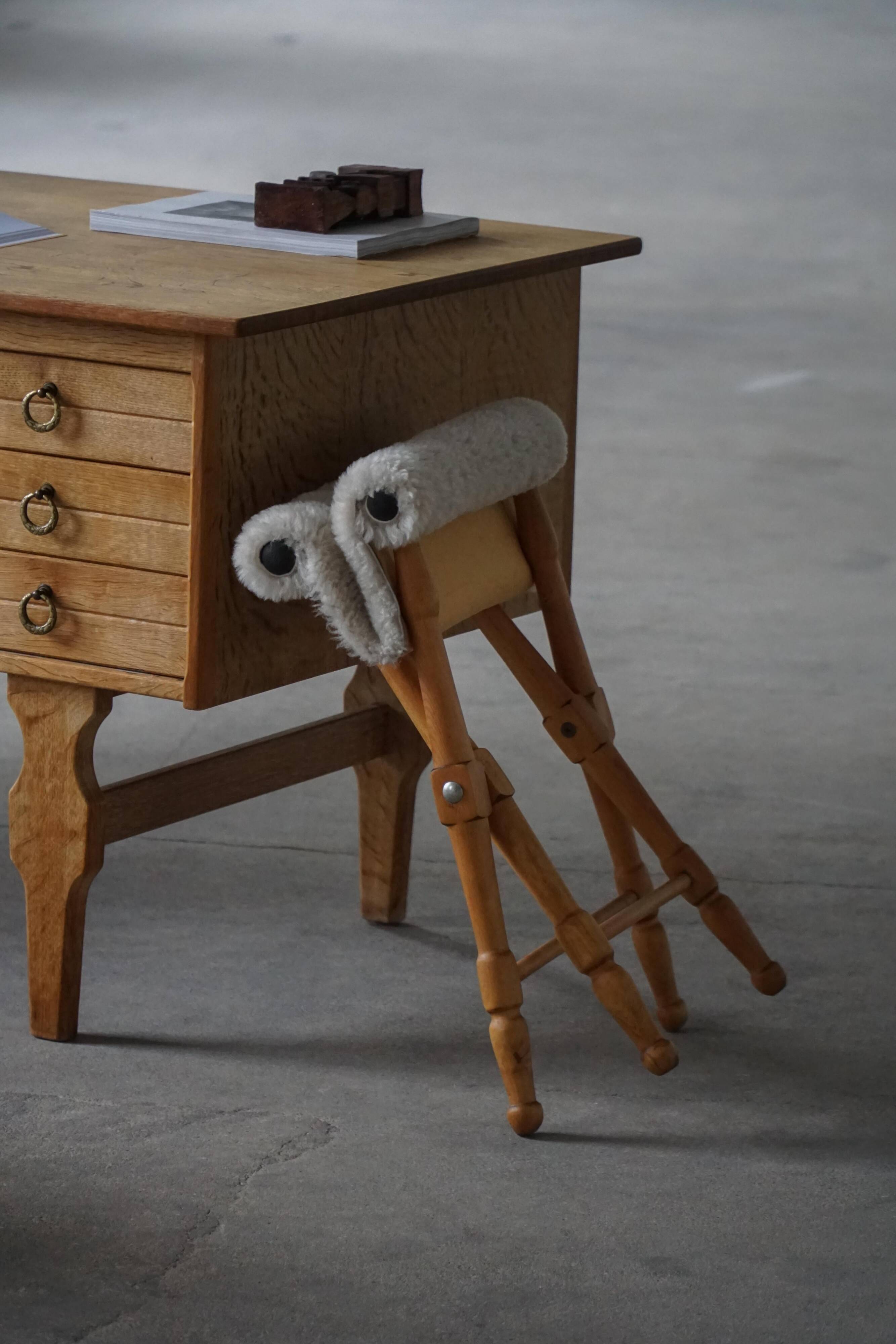 Pair of Danish mid-century folding stools with sheepskin upholstery, 1960.