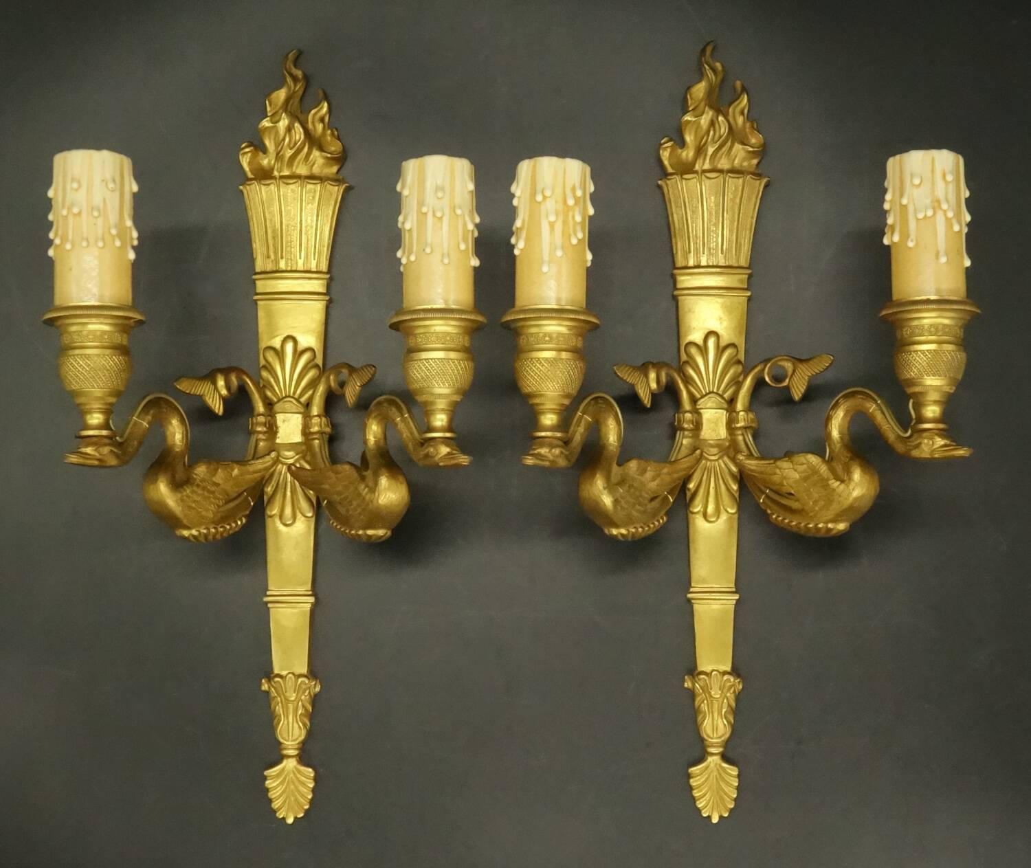 Pair of large wall sconces, torch and swans, Empire style - gilded bronze