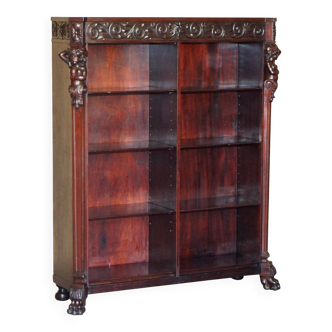 Hand-carved library circa 1900 in hardwood with Hermes statues.