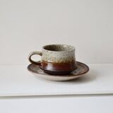 Cups and saucers in sandstone