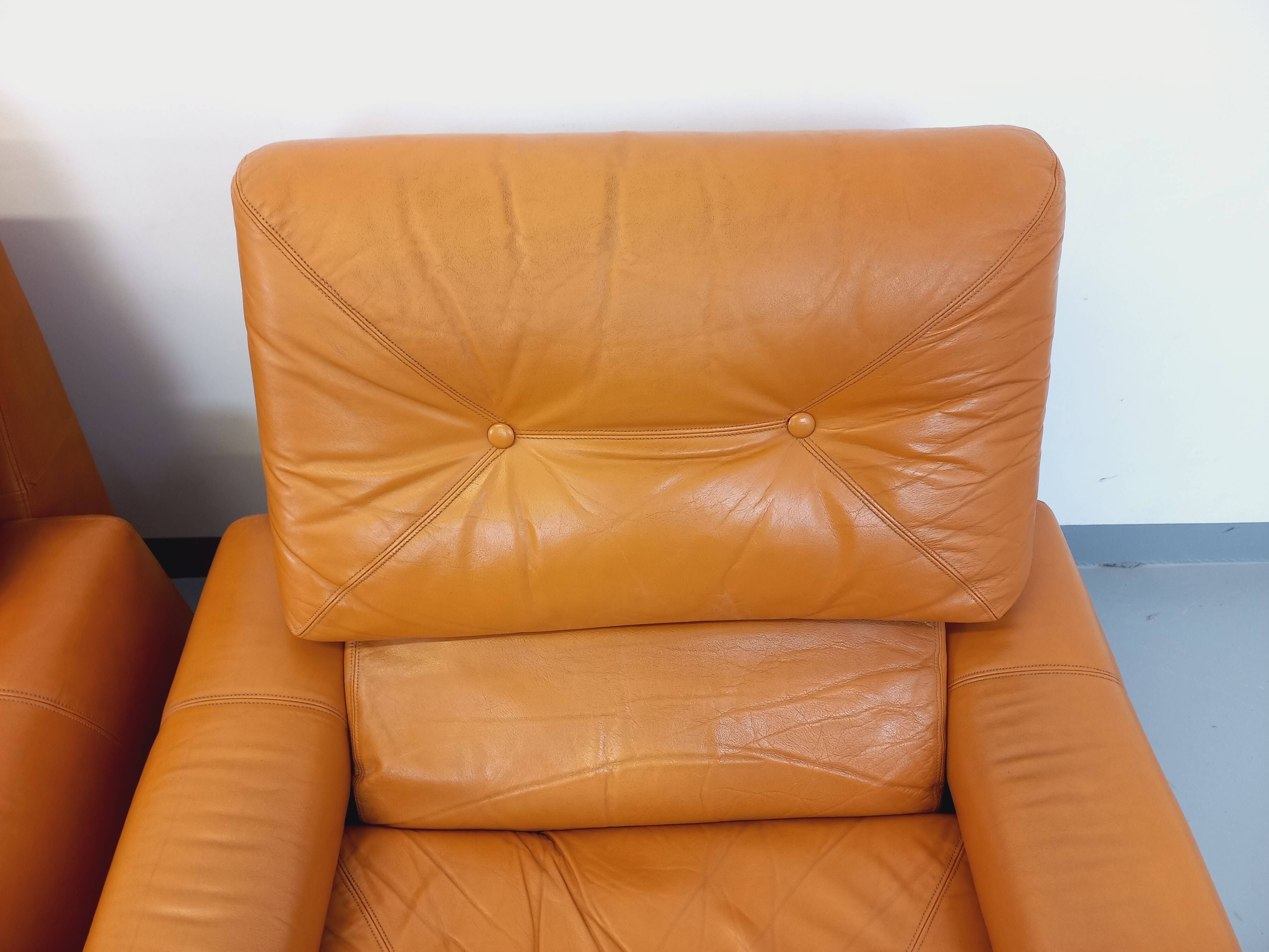 Pair of vintage leather lounge chairs from the 60s and 70s