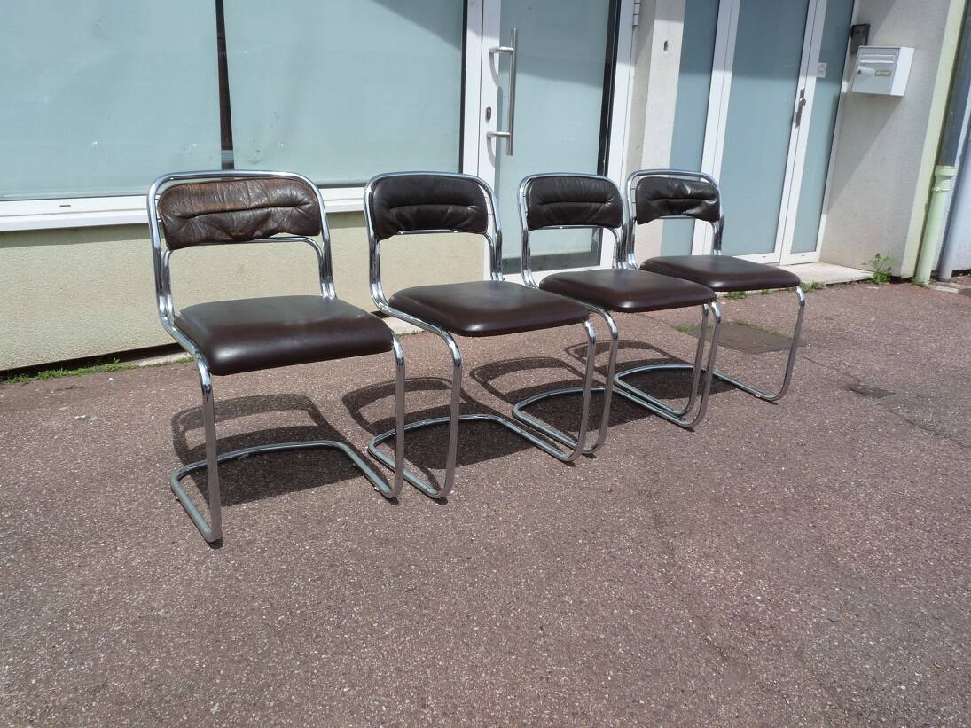 Set of 4 chrome metal and vintage leather chairs