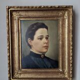 Oil on canvas portrait in an antique gilded wooden frame.