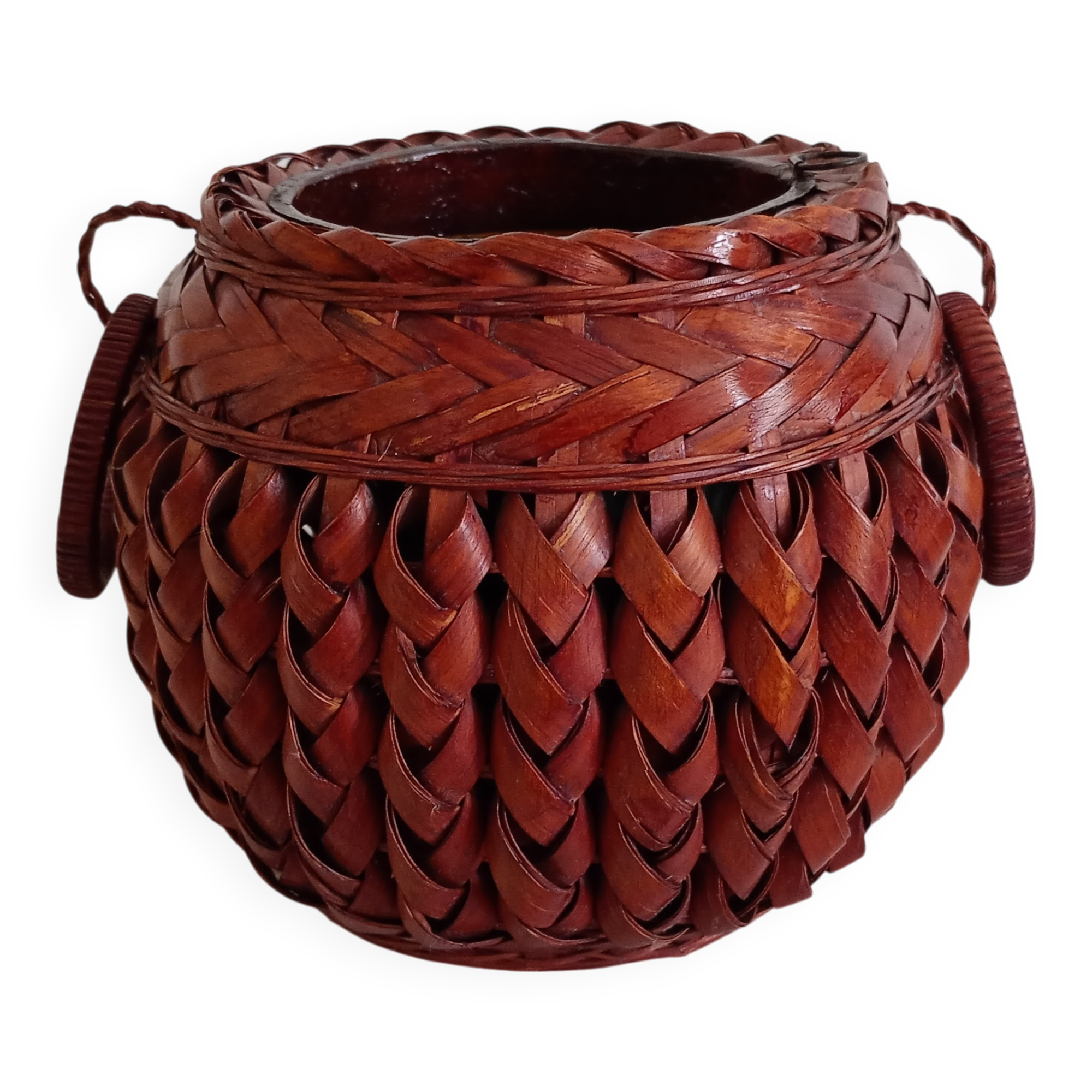 Japanese vase made of woven bamboo. Ikebana.