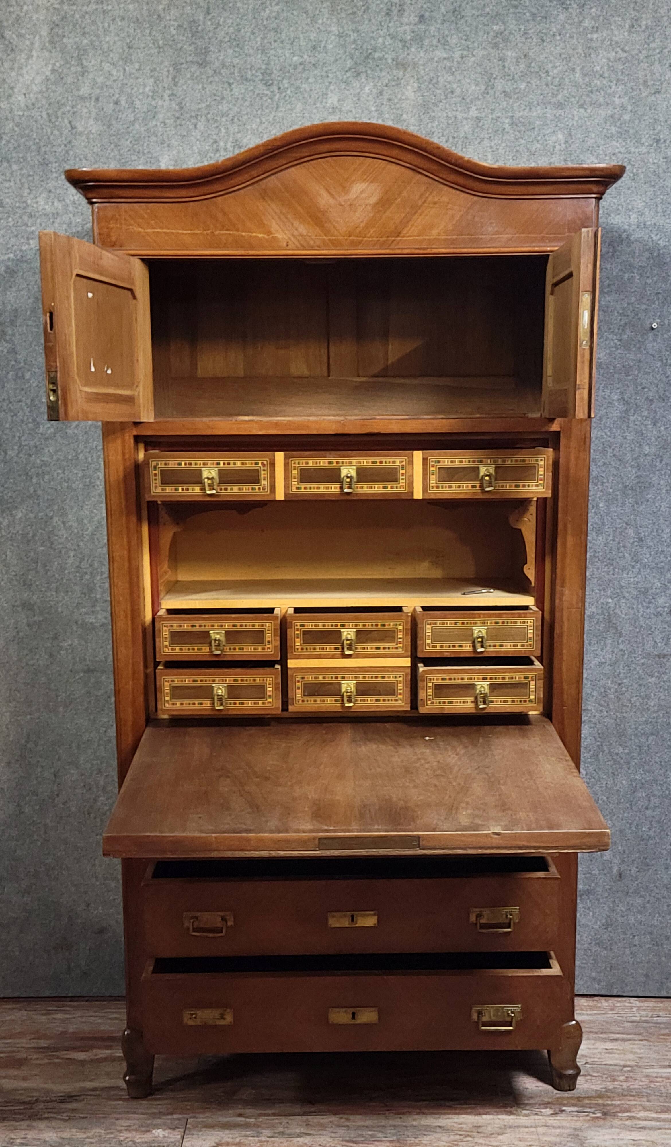 Rare Biedermeier guillotine secretary, made of walnut and marquetry.
