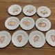 Set of 10 plates decorated with Sarreguemines porcelain fruit