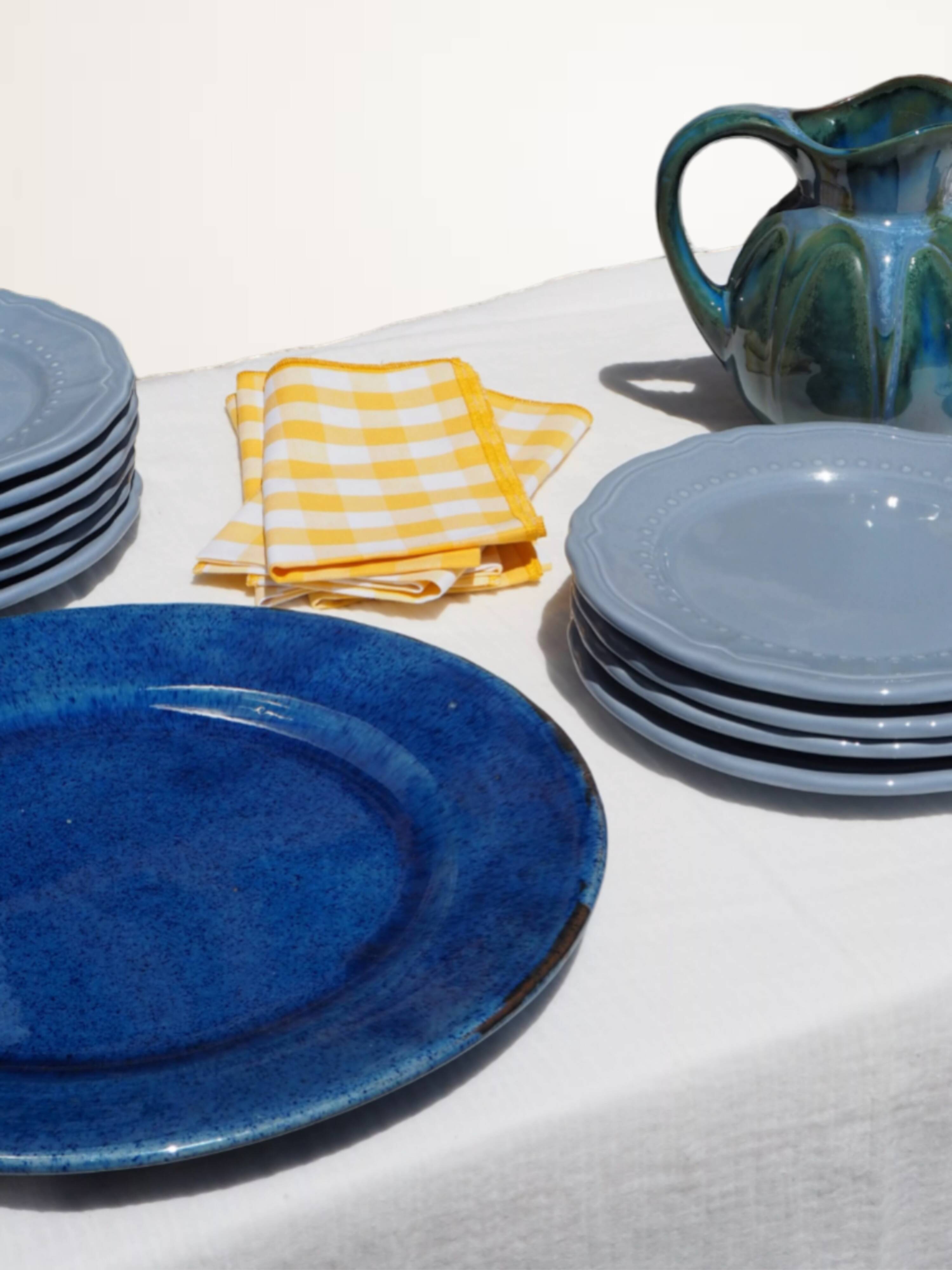 Set of 4 blue ceramic dessert plates.