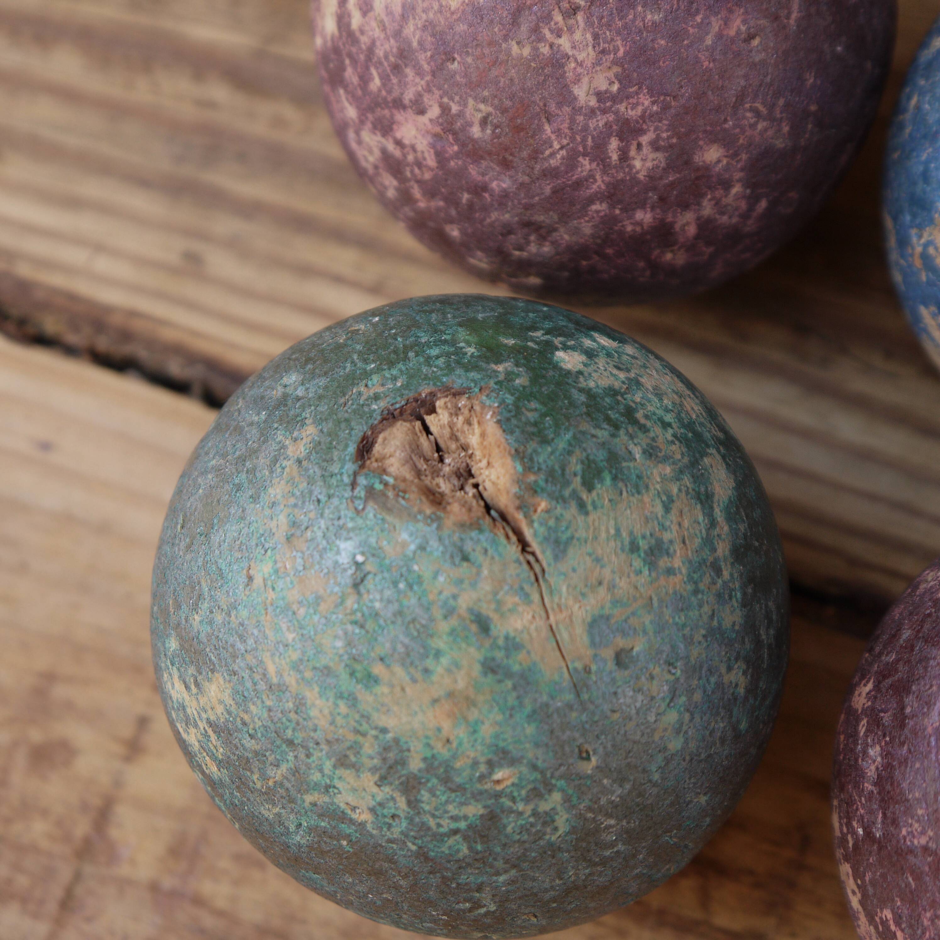 Four bowling balls